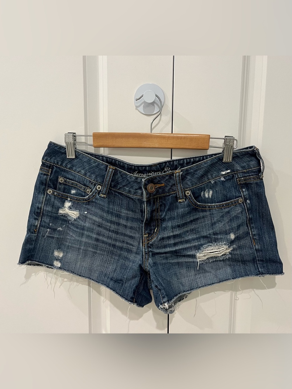 American Eagle size 10 cut off style distressed dark denim shorts with 3” inseam